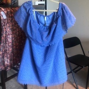 Mini dress can be worn on and off the shoulder